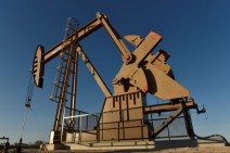 Oil dips on rising U.S. supply, but looming Iran sanctions prevent bigger fall