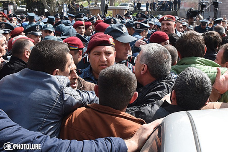 Participant of protest action taken to police department after clashes between Spayka company employees and police
